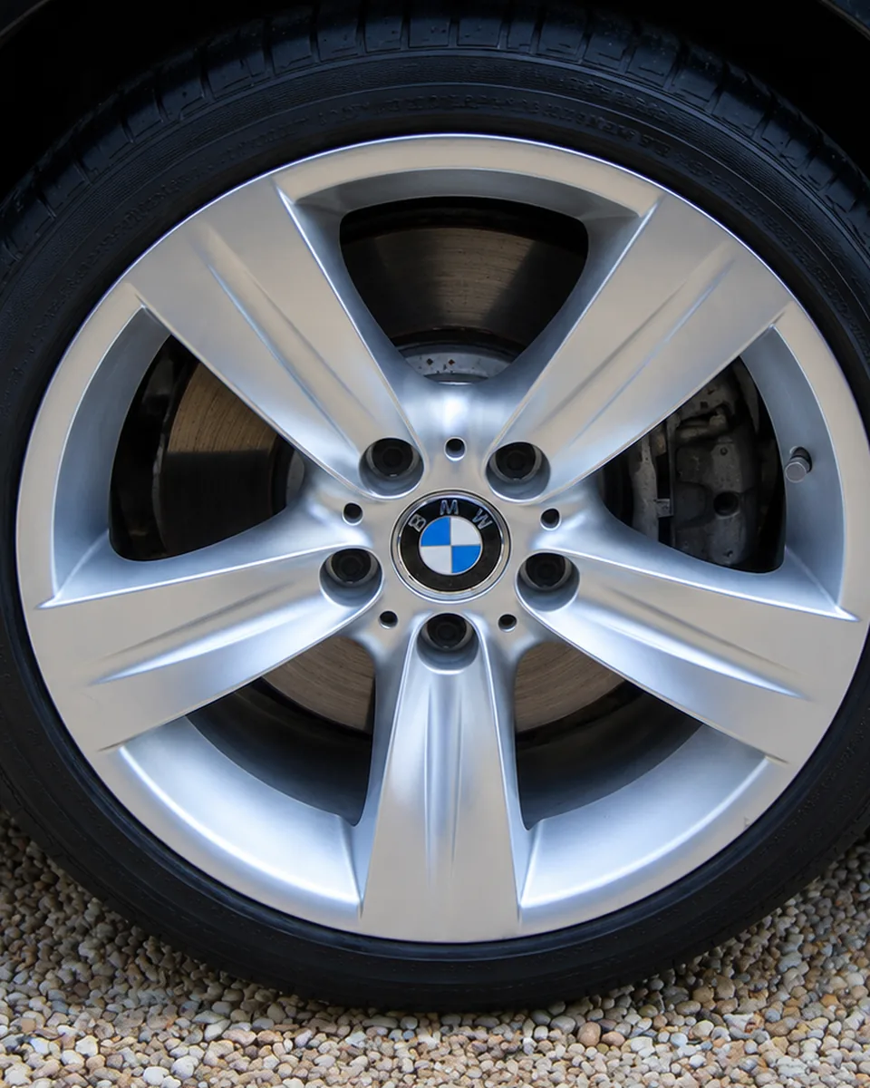 After wheel cleaning with bright alloy finish and dressed tire.